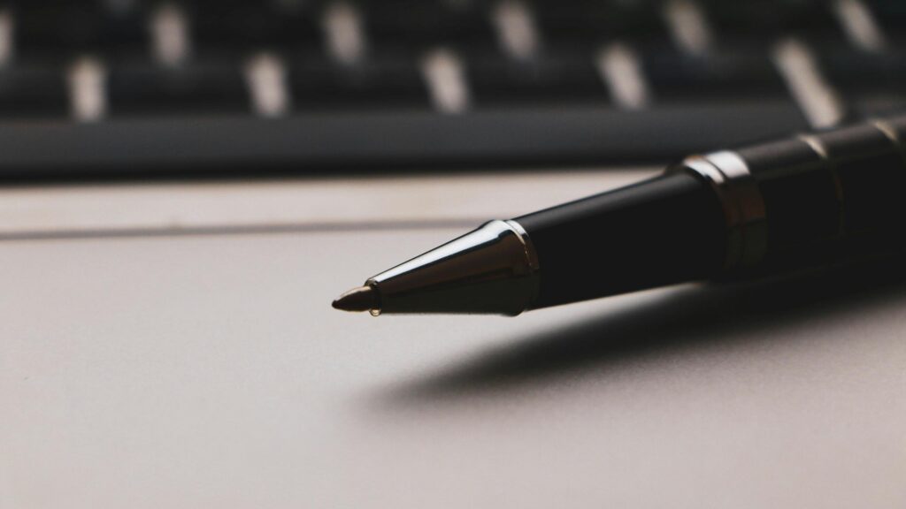 Elegant Black Executive Pen Close-up Professional 4K Desktop Wallpaper