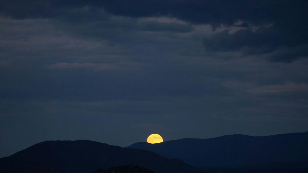 Golden Full Moon Rising Over Dark Silhouette Mountains Desktop Wallpaper
