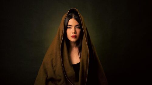 Mysterious Woman in Brown Hood Portrait 4K Desktop Wallpaper