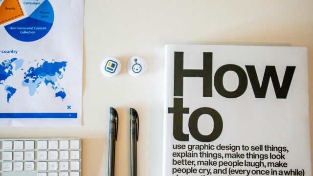 Minimalist Graphic Designer Workspace with How To Book 4K Wallpaper