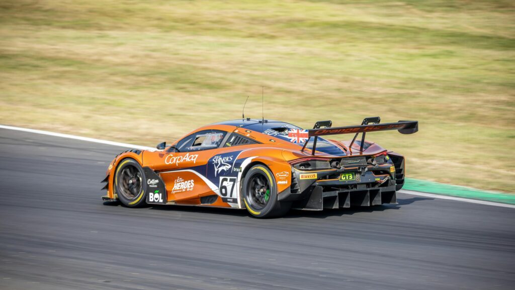 Orange McLaren 720S GT3 Racing Car Speeding on Track 4K Wallpaper