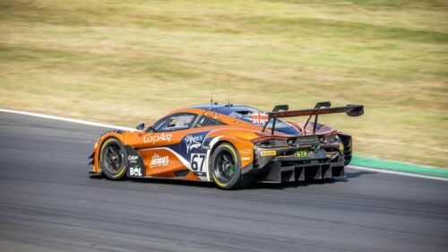 Orange McLaren 720S GT3 Racing Car Speeding on Track 4K Wallpaper