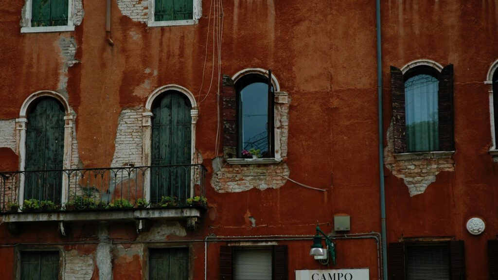 Weathered Terracotta Venetian Building Facade 4K Wallpaper
