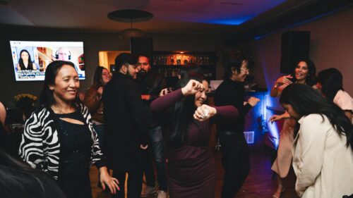 Joyful Group of Friends Celebrating and Dancing Party Night Desktop Wallpaper