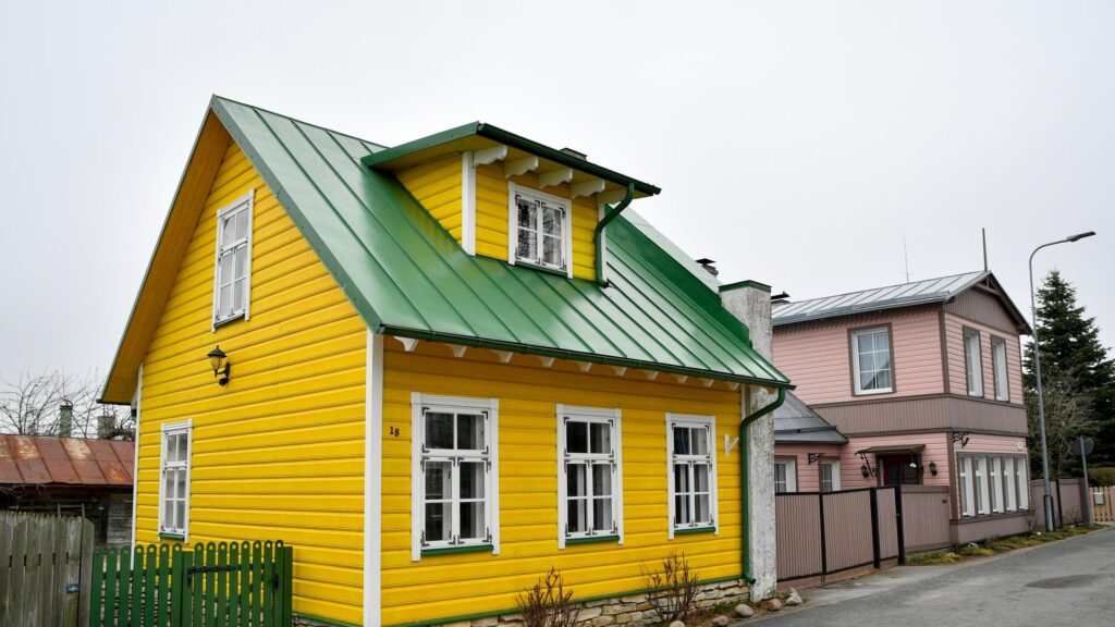 Charming Yellow and Pink Houses in Historic Estonian Town Desktop Wallpaper