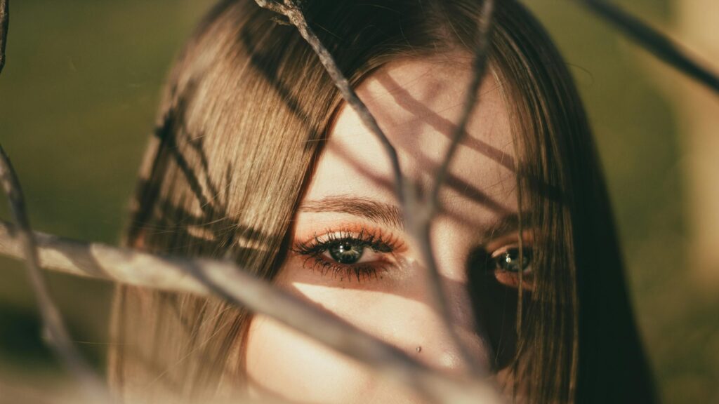 Stunning Girl Eye Close-up With Nature Tree Branch Shadows 4K Wallpaper