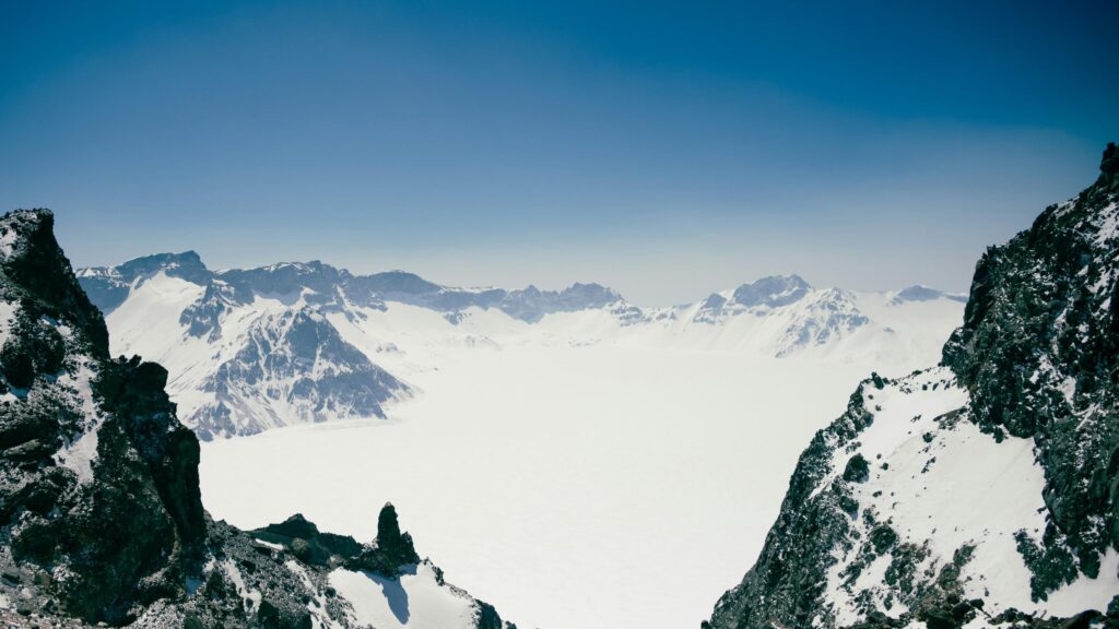 Breathtaking Snowy Mountain Peak Crater 4K Wallpaper