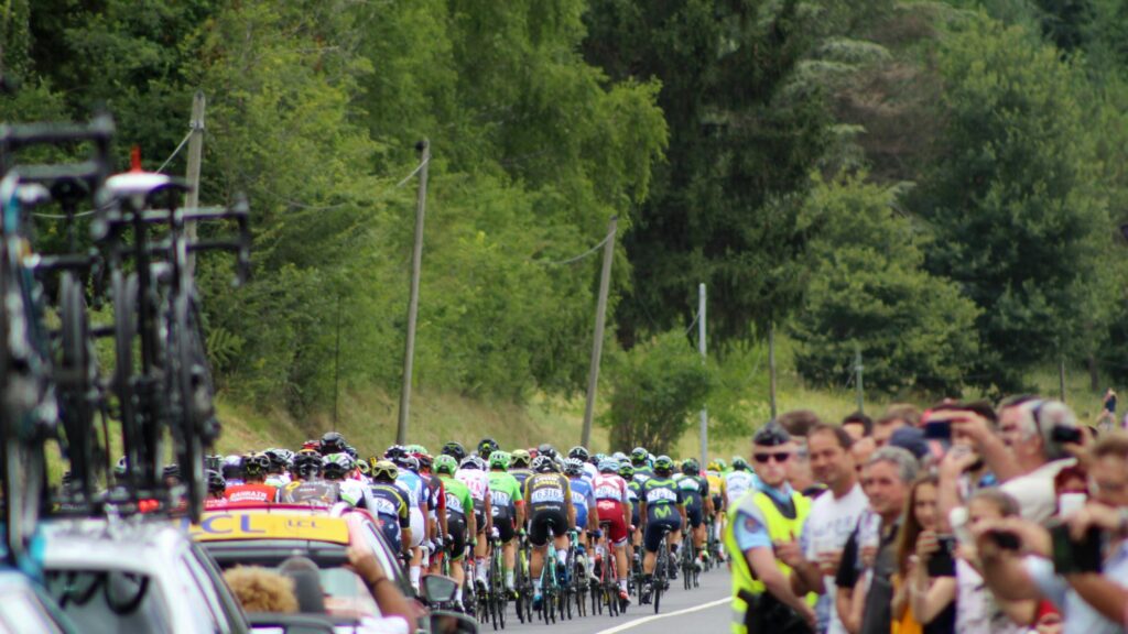 Tour de France Peloton Racing Through Scenic Countryside Desktop Wallpaper
