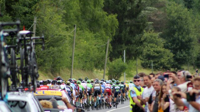 Tour de France Peloton Racing Through Scenic Countryside Desktop Wallpaper