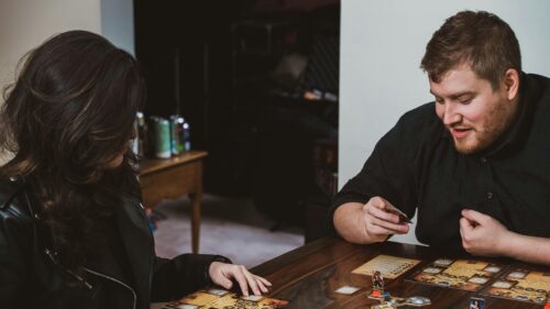Couple Playing Board Game at Home Evening Desktop Wallpaper