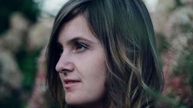 Dreamy Profile Portrait of a Young Woman Soft Focus 4K Wallpaper
