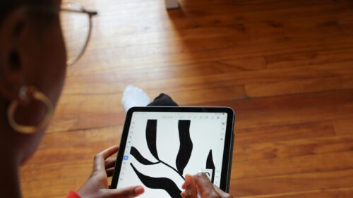 Digital Artist Sketching Abstract Curves on Tablet PC Wallpaper