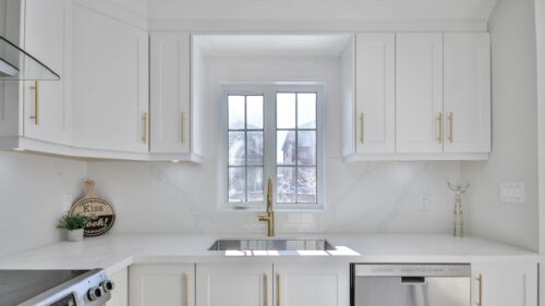 Modern White Kitchen Interior with Gold Accents 4K Desktop Wallpaper