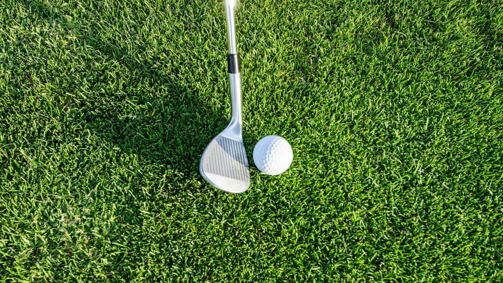 Golf Club and Ball on Lush Green Grass Desktop Wallpaper
