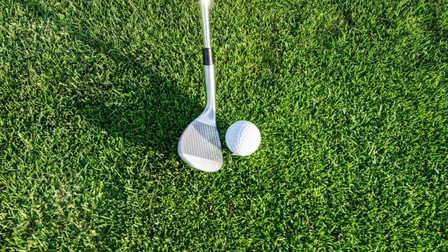 Golf Club and Ball on Lush Green Grass Desktop Wallpaper