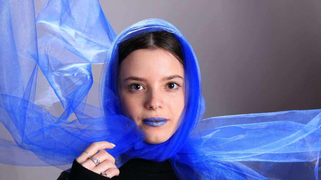 Stunning Portrait of Young Woman with Blue Veil 4K Wallpaper