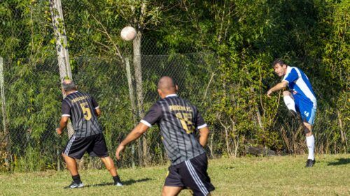 Intense Amateur Soccer Match Action Shot Desktop Wallpaper