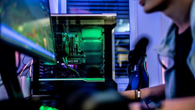 Gaming PC Setup with Glowing Green Components 4K Wallpaper
