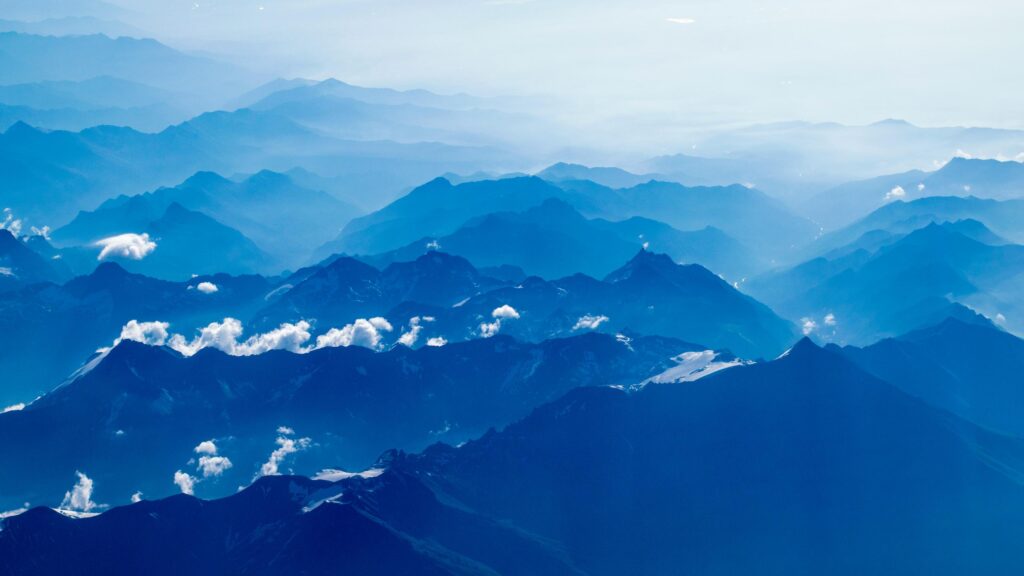 Breathtaking Blue Aerial Mountain Peaks Desktop Wallpaper