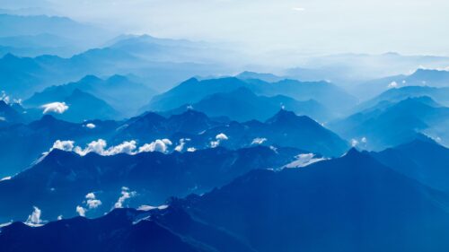 Breathtaking Blue Aerial Mountain Peaks Desktop Wallpaper