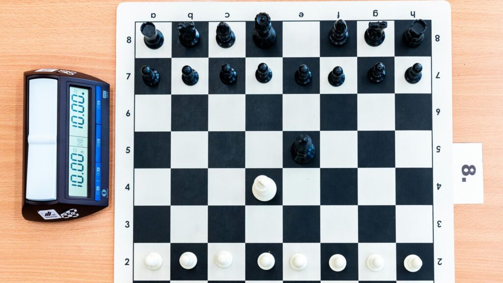 Professional Chess Board and Digital Timer Setup 4K Wallpaper