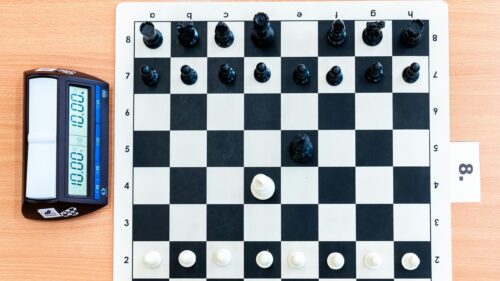 Professional Chess Board and Digital Timer Setup 4K Wallpaper