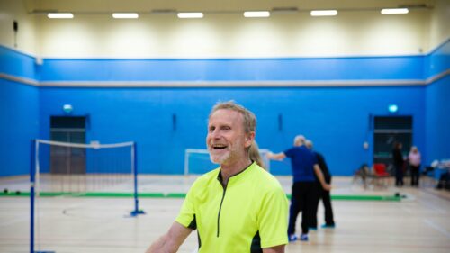 Joyful Mature Man in Sportswear Indoor Gym Desktop Wallpaper
