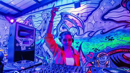 Female DJ Performing at Neon Party Night 4K Wallpaper