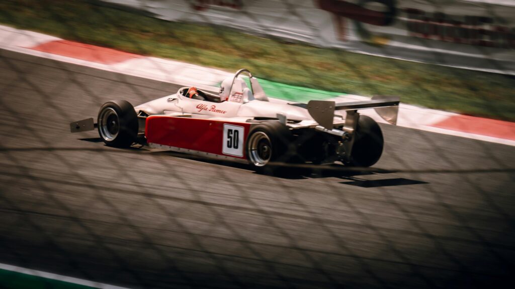Vintage Alfa Romeo Formula Race Car Speeding on Track 4K Wallpaper