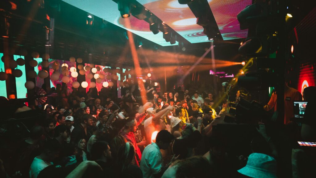 Energetic Nightclub Crowd Party Lights 4K Wallpaper