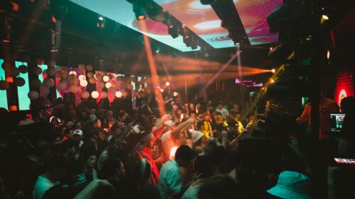 Energetic Nightclub Crowd Party Lights 4K Wallpaper