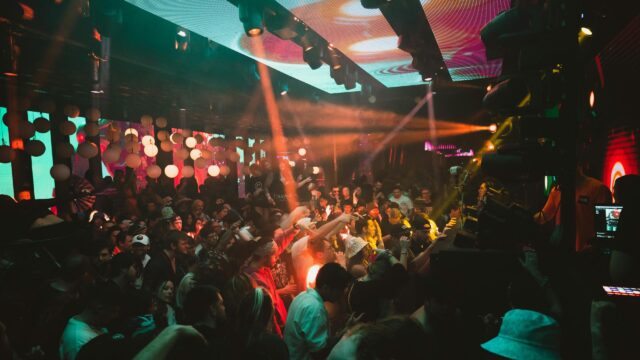 Energetic Nightclub Crowd Party Lights 4K Wallpaper