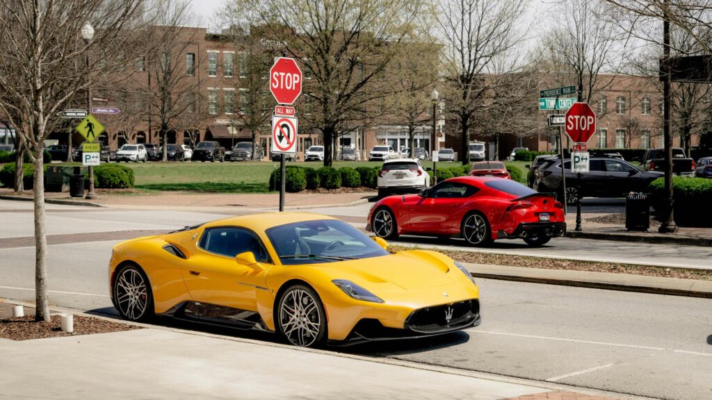 Yellow Maserati MC20 and Red Toyota Supra Sports Cars 4K Wallpaper