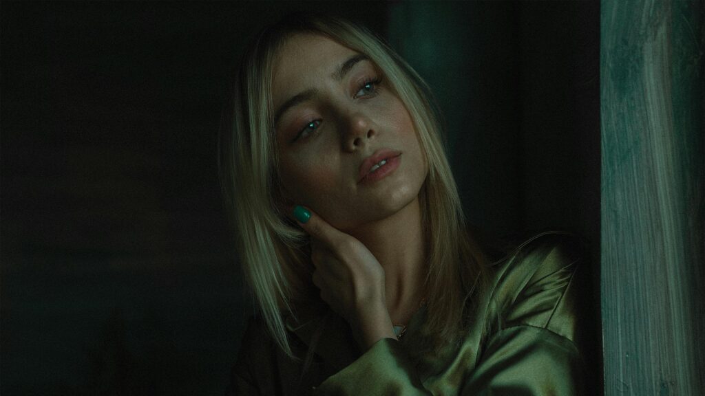 Portrait of a Blonde Woman in Green Silk 4K Desktop Wallpaper