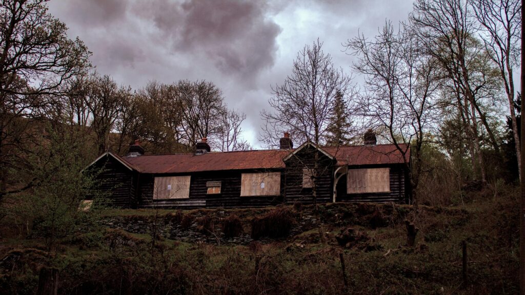 Abandoned Wooden House in Dark Forest Landscape Desktop Wallpaper
