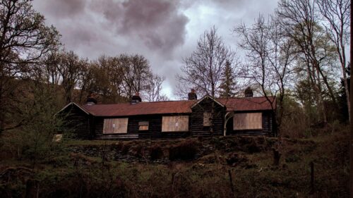 Abandoned Wooden House in Dark Forest Landscape Desktop Wallpaper