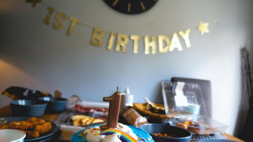 Festive 1st Birthday Celebration Cake with Gold Candle 4K Wallpaper