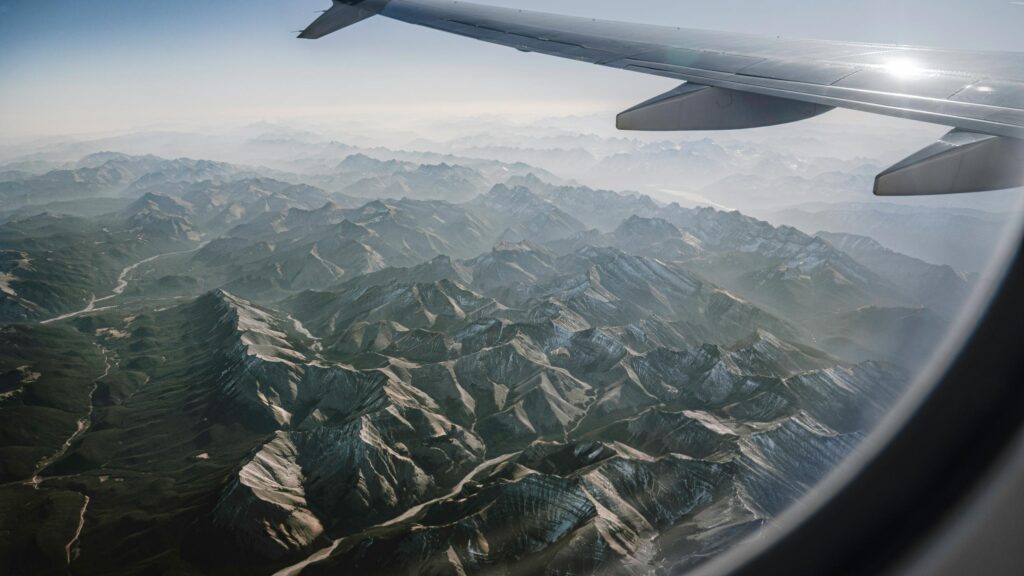 Stunning Aerial View of Snow-Capped Mountain Peaks 4K Desktop Wallpaper