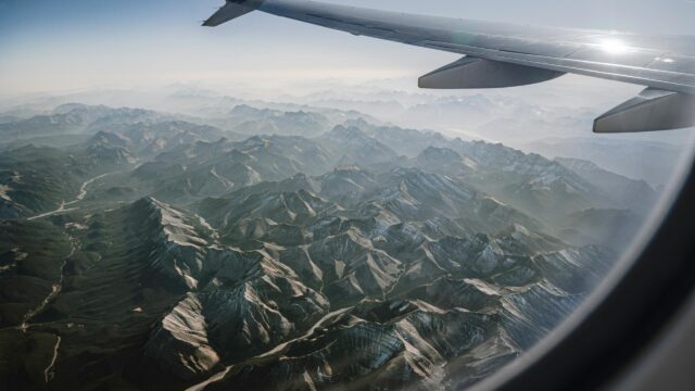 Stunning Aerial View of Snow-Capped Mountain Peaks 4K Desktop Wallpaper