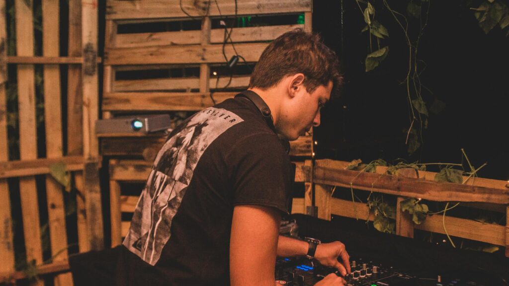 DJ Playing Music at Night Party 4K Desktop Wallpaper