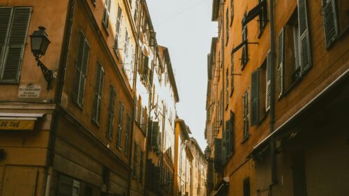 Charming Old Town Street with Yellow Buildings Desktop Wallpaper