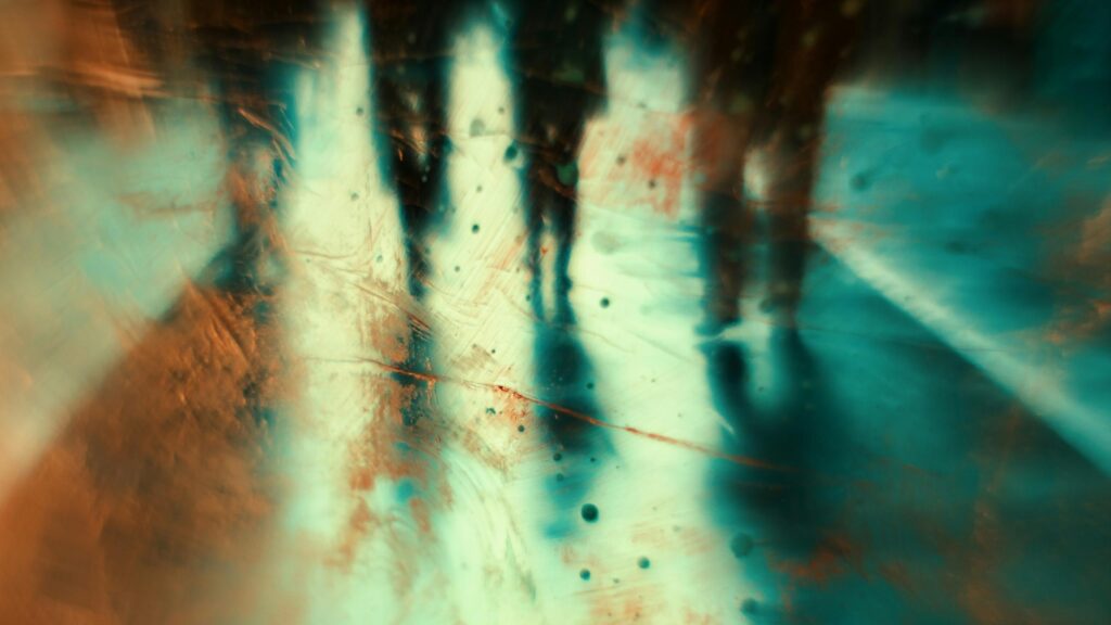 Abstract Silhouette People Walking Through Glowing Light 4K Wallpaper