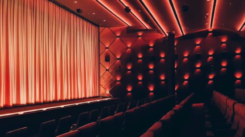 Cinematic Empty Movie Theater Red Ambient Lighting 4K Desktop Wallpaper