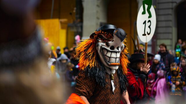 Creepy Carnival Mask Character Costume at Festival 4K Wallpaper
