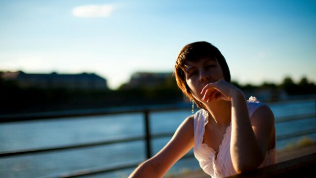 Woman Resting Hand on Chin Silhouette Sunset Desktop Wallpaper