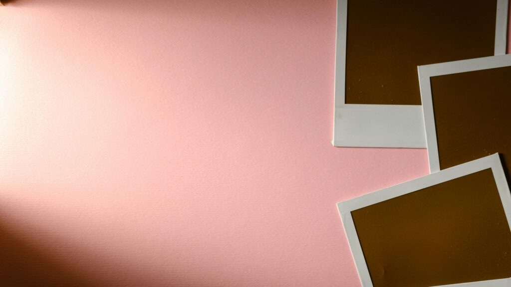 Minimalist Pink Backdrop with Vintage Polaroid Photo Frames Desktop Wallpaper