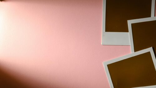 Minimalist Pink Backdrop with Vintage Polaroid Photo Frames Desktop Wallpaper