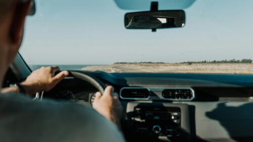 POV Driving Along the Scenic Coastal Road 4K Desktop Wallpaper