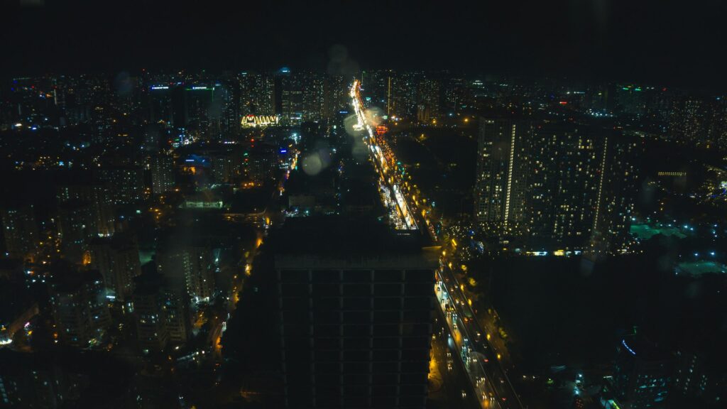 Breathtaking Cityscape Night View with Illuminated Highway Desktop Wallpaper
