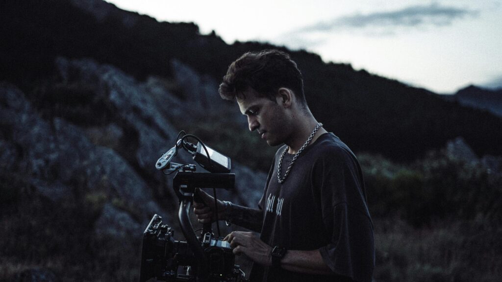 Cinematographer Working with Film Camera at Dusk Desktop Wallpaper